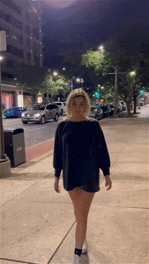 Beautiful horny blonde college teen shows off her round tits in the middle of the city
